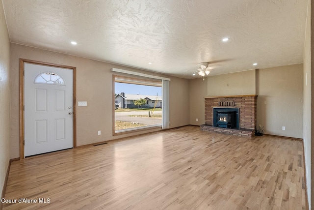 59 W Lincoln Ave, Priest River, ID 83856 - unfurnished living room featuring a ceiling fan, light wood-type flooring, plenty of natural light, a textured ceiling, and recessed lighting