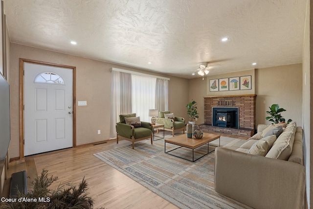 59 W Lincoln Ave, Priest River, ID 83856 - living room featuring ceiling fan, light wood finished floors, a textured ceiling, healthy amount of natural light, and recessed lighting