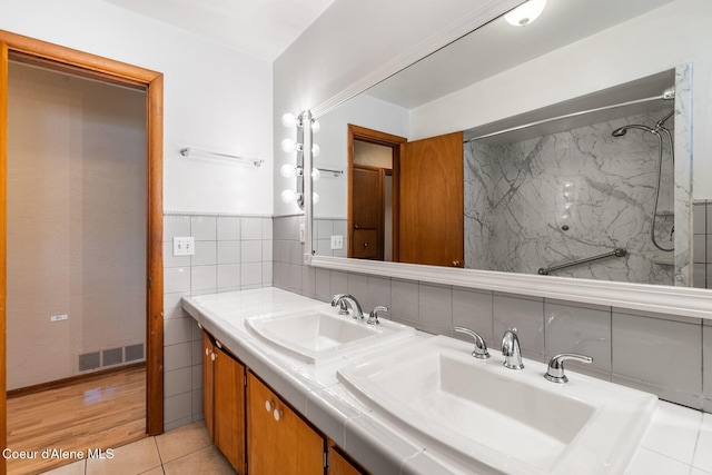 59 W Lincoln Ave, Priest River, ID 83856 - full bath featuring double vanity, tile walls, and tile patterned flooring