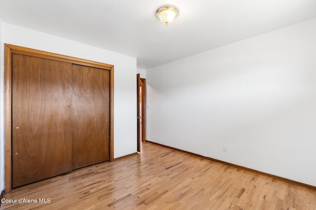 59 W Lincoln Ave, Priest River, ID 83856 - unfurnished bedroom with light wood-style floors and a closet