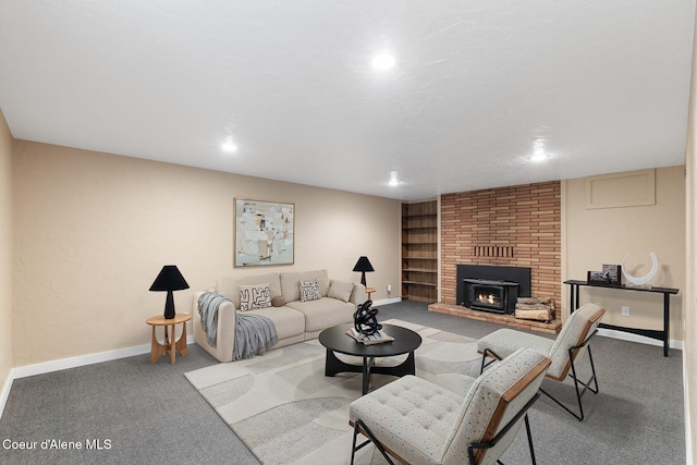 59 W Lincoln Ave, Priest River, ID 83856 - carpeted living room featuring a fireplace, recessed lighting, and built in features