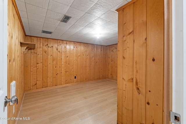 59 W Lincoln Ave, Priest River, ID 83856 - unfurnished room with light wood finished floors and wood walls