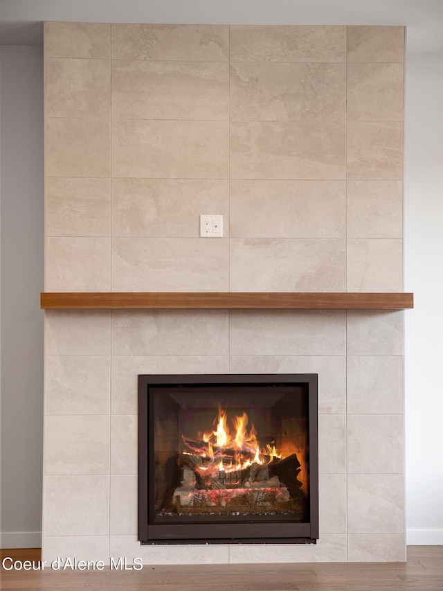 1037 E Railroad Ave, Post Falls, ID 83854 - detailed view of wood finished floors and a tile fireplace