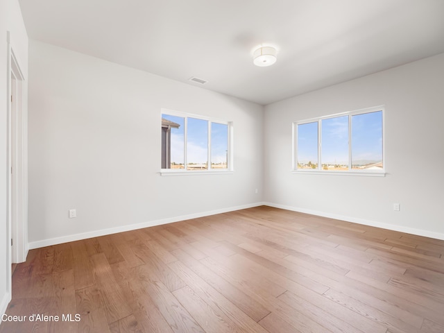 1037 E Railroad Ave, Post Falls, ID 83854 - spare room featuring healthy amount of natural light and wood finished floors