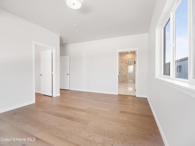 1037 E Railroad Ave, Post Falls, ID 83854 - unfurnished room with light wood-style floors and baseboards