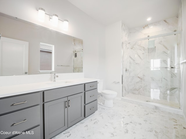 1037 E Railroad Ave, Post Falls, ID 83854 - bathroom with a marble finish shower, marble look tile flooring, and vanity