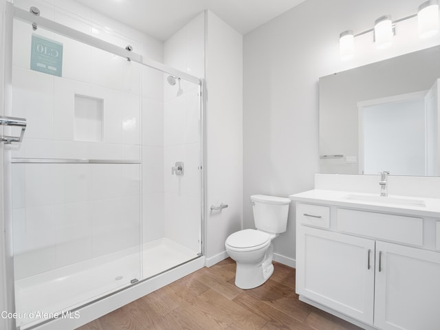 1037 E Railroad Ave, Post Falls, ID 83854 - bathroom with wood finished floors, vanity, and a stall shower