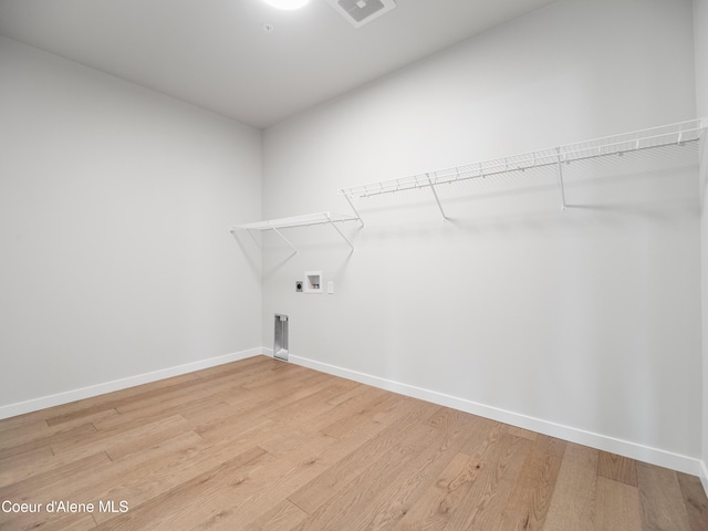 1037 E Railroad Ave, Post Falls, ID 83854 - washroom with hookup for a washing machine, light wood-style floors, and hookup for an electric dryer