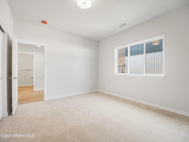 1037 E Railroad Ave, Post Falls, ID 83854 - empty room with carpet flooring and baseboards