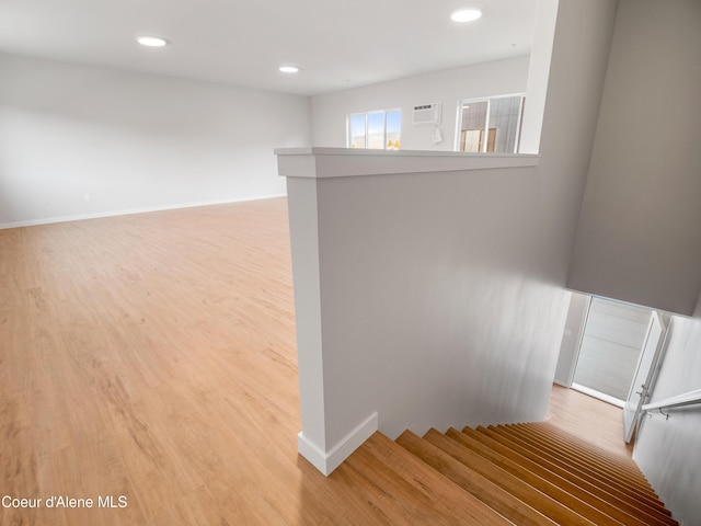 1037 E Railroad Ave, Post Falls, ID 83854 - stairway featuring wood finished floors, recessed lighting, and a wall mounted AC