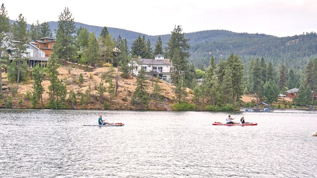 1037 E Railroad Ave, Post Falls, ID 83854 - water view featuring a mountainous background and a forest