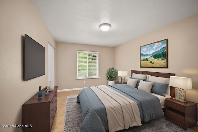 5188 E Twila Ct, Post Falls, ID 83854 - bedroom with light wood-style flooring and baseboards