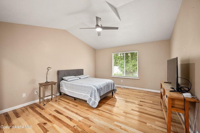5188 E Twila Ct, Post Falls, ID 83854 - bedroom with light wood finished floors, vaulted ceiling, and a ceiling fan