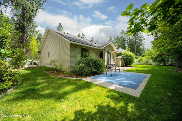 5188 E Twila Ct, Post Falls, ID 83854 - rear view of property featuring a patio area and a shingled roof
