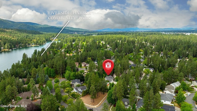 5188 E Twila Ct, Post Falls, ID 83854 - aerial view of a heavily wooded area and a water and mountain view