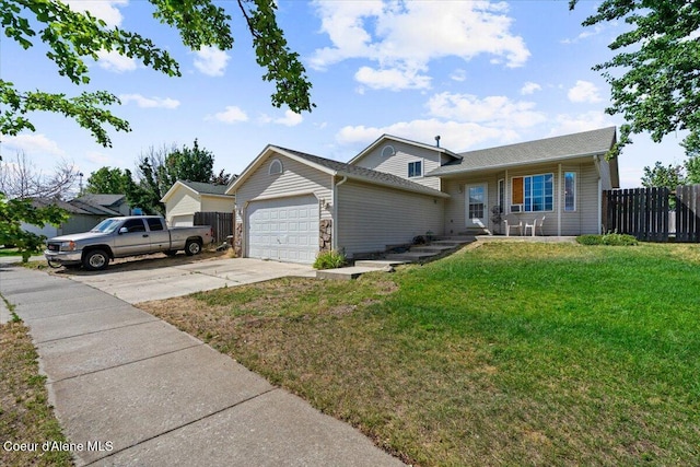3569 E Jordan Dr, Post Falls, ID 83854 - view of front of property with an attached garage, driveway, and covered porch