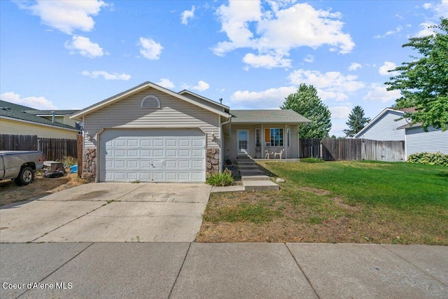 3569 E Jordan Dr, Post Falls, ID 83854 - ranch-style home with concrete driveway, an attached garage, and stone siding