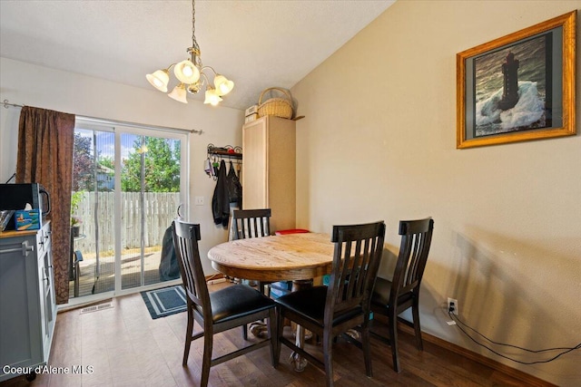 3569 E Jordan Dr, Post Falls, ID 83854 - dining area with a chandelier and wood finished floors