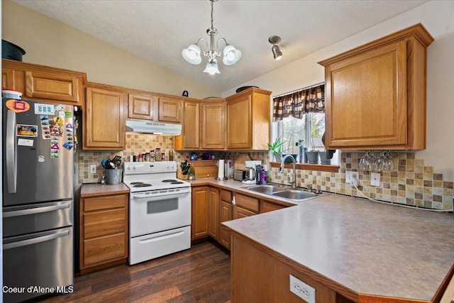 3569 E Jordan Dr, Post Falls, ID 83854 - kitchen featuring freestanding refrigerator, white electric stove, vaulted ceiling, a chandelier, and tasteful backsplash