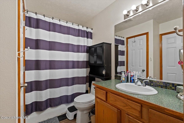3569 E Jordan Dr, Post Falls, ID 83854 - bathroom featuring vanity and a textured ceiling