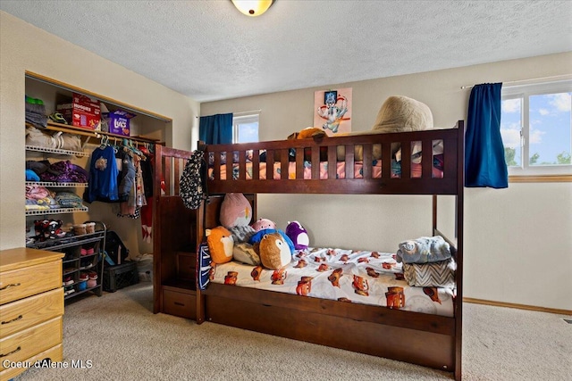 3569 E Jordan Dr, Post Falls, ID 83854 - carpeted bedroom featuring a textured ceiling and a closet