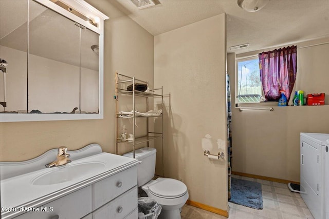 3569 E Jordan Dr, Post Falls, ID 83854 - bathroom with separate washer and dryer, vanity, and tile patterned floors