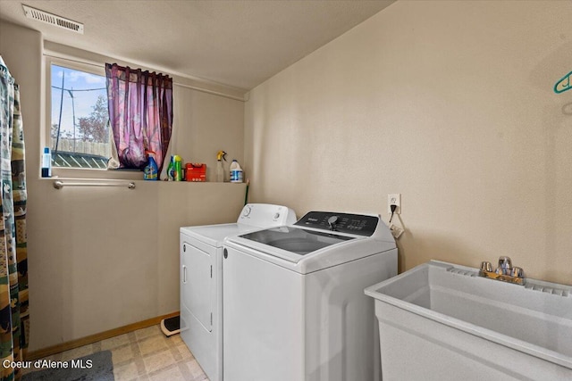 3569 E Jordan Dr, Post Falls, ID 83854 - laundry room featuring light floors and washing machine and clothes dryer
