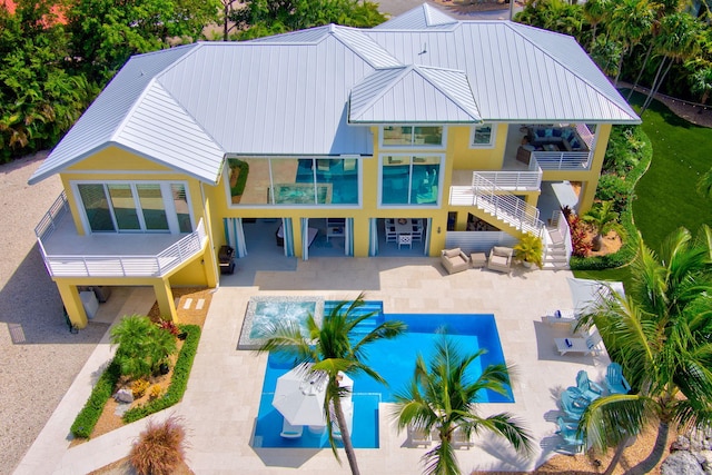 rear view of house featuring an outdoor hangout area and a patio area