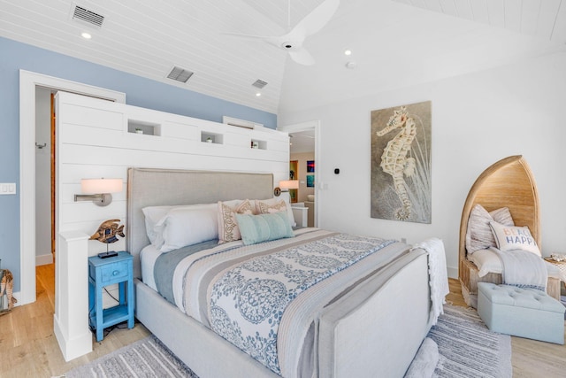 bedroom featuring lofted ceiling, wood ceiling, light hardwood / wood-style flooring, and ceiling fan