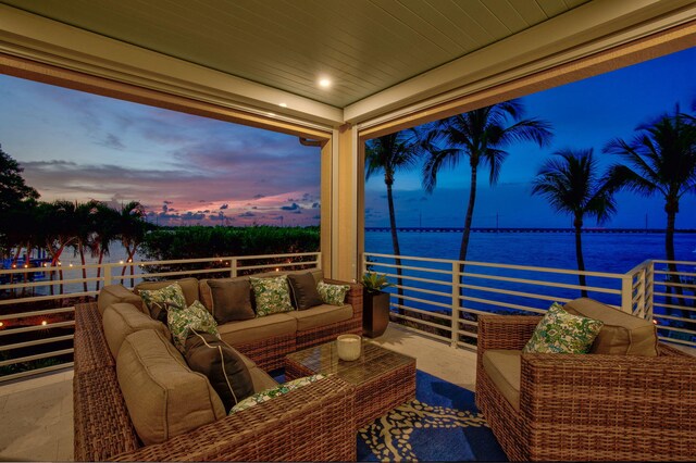 exterior space featuring an outdoor living space and a water view