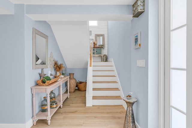 stairway with hardwood / wood-style flooring