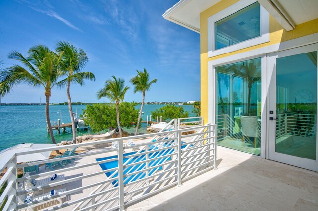 balcony featuring a water view