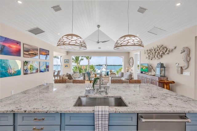 kitchen featuring sink, light stone countertops, hanging light fixtures, and wooden ceiling