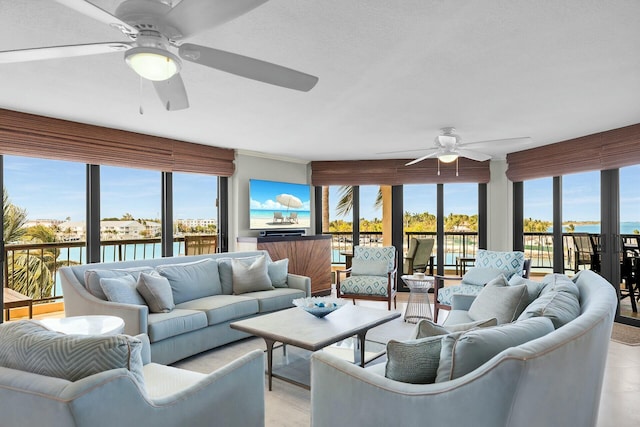 living room featuring a ceiling fan