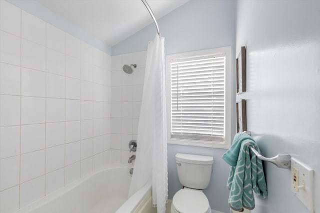 bathroom featuring shower / tub combo with curtain, toilet, and vaulted ceiling