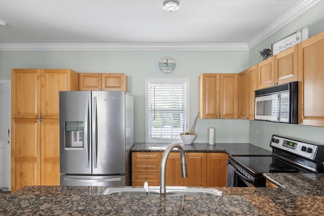 kitchen featuring sink, appliances with stainless steel finishes, dark stone countertops, ornamental molding, and light brown cabinets