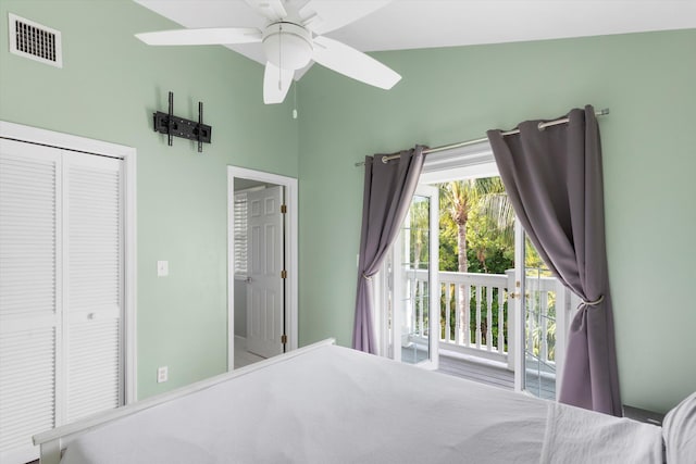 bedroom with vaulted ceiling and access to outside