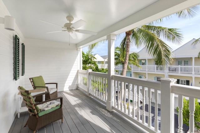 wooden deck featuring ceiling fan