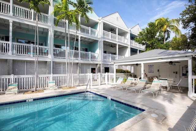 view of pool with ceiling fan and a patio area