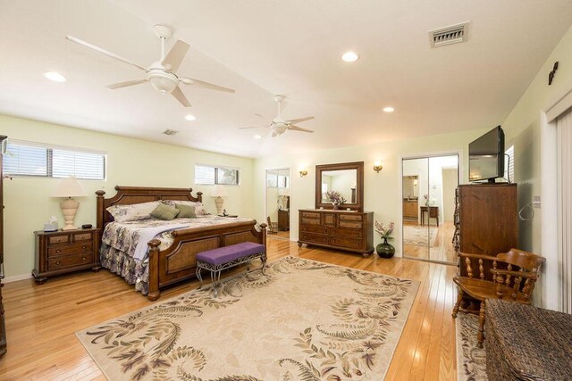 bedroom with ceiling fan and light hardwood / wood-style flooring