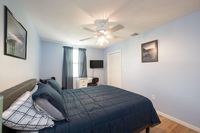 bedroom with ceiling fan and light wood-type flooring