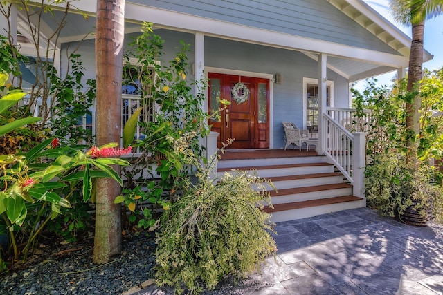 doorway to property with a porch