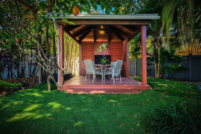 exterior space with a yard, a gazebo, and fence