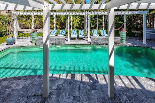 pool featuring a patio and a pergola