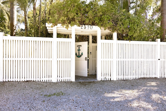 view of gate featuring fence