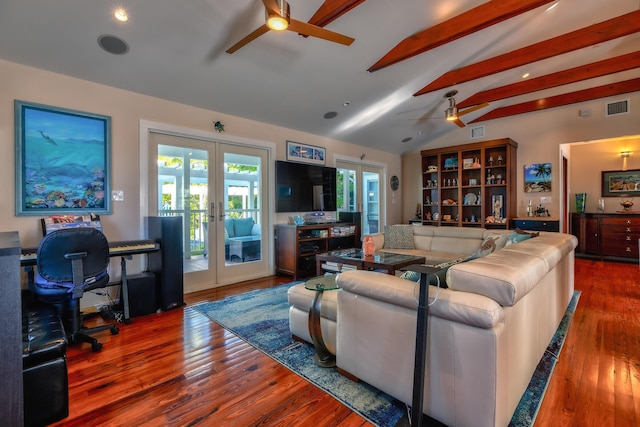 living area with vaulted ceiling with beams, visible vents, and french doors