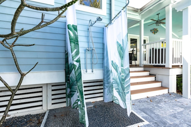 view of exterior entry with covered porch