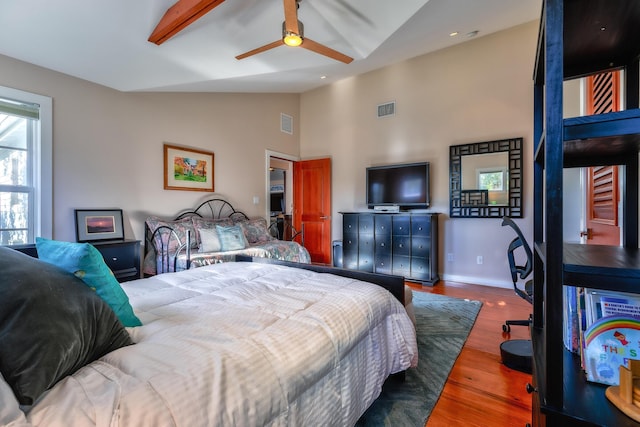 bedroom featuring recessed lighting, visible vents, wood finished floors, high vaulted ceiling, and baseboards