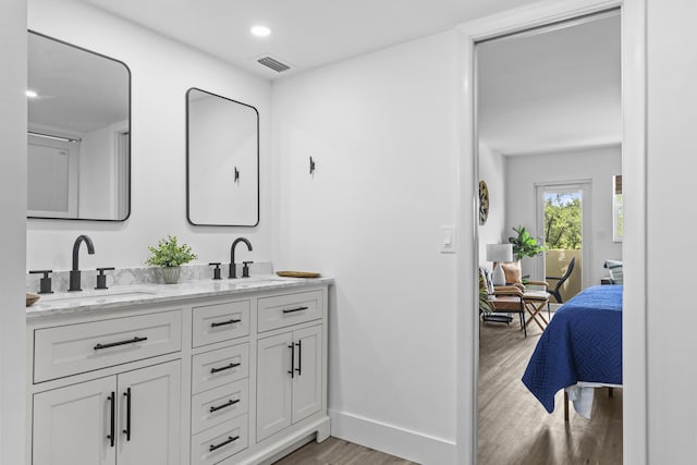 bathroom featuring hardwood / wood-style flooring and vanity