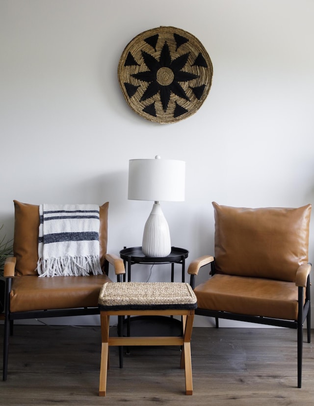 sitting room with wood-type flooring